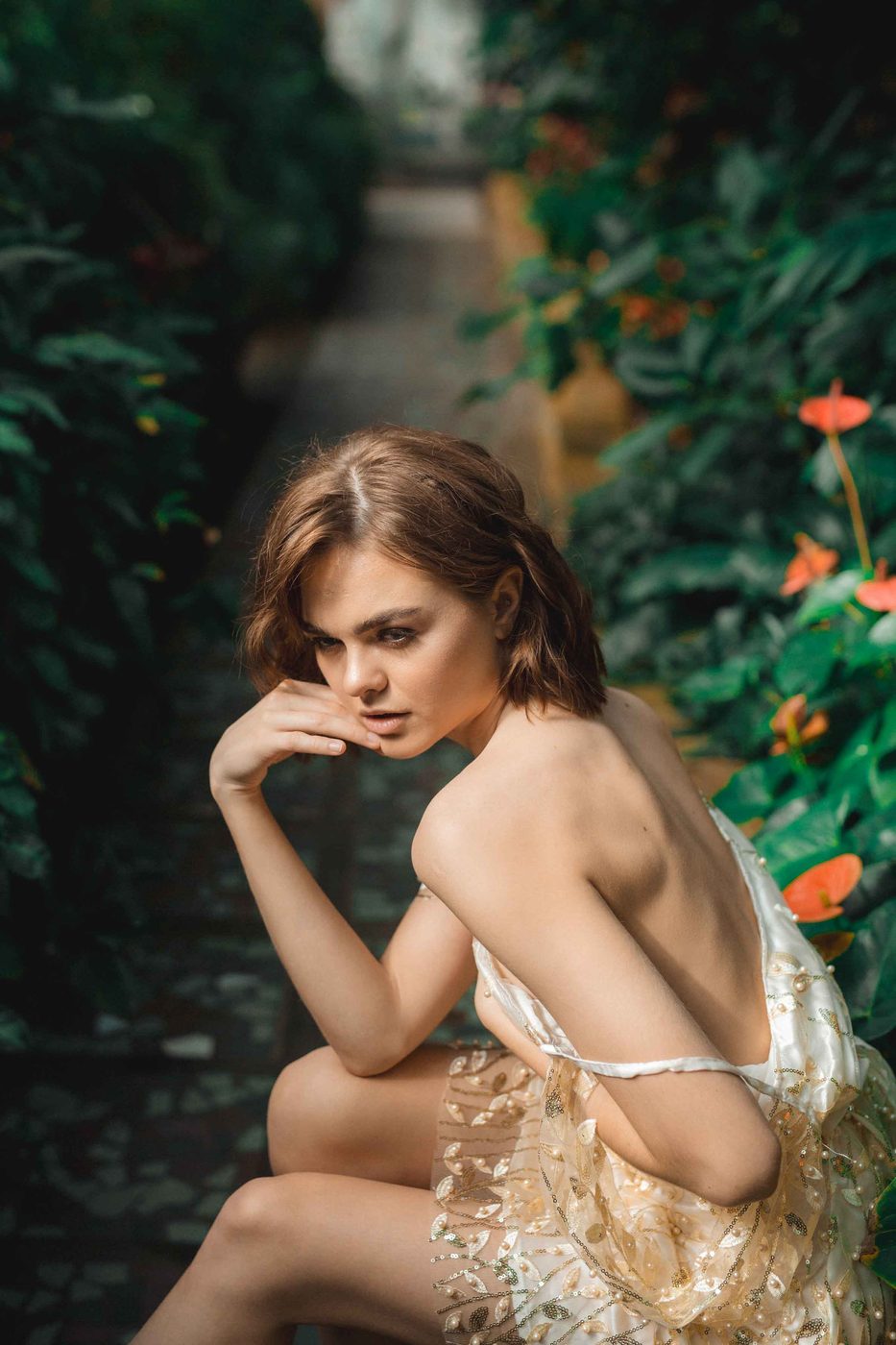 Bride in a garden, graded — shadows opened, the greens and the flowers brought up